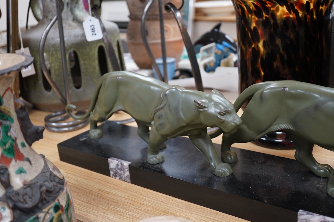 An Art Deco patinated spelter and marble figure of panthers, signed T. Cartier, 70cm